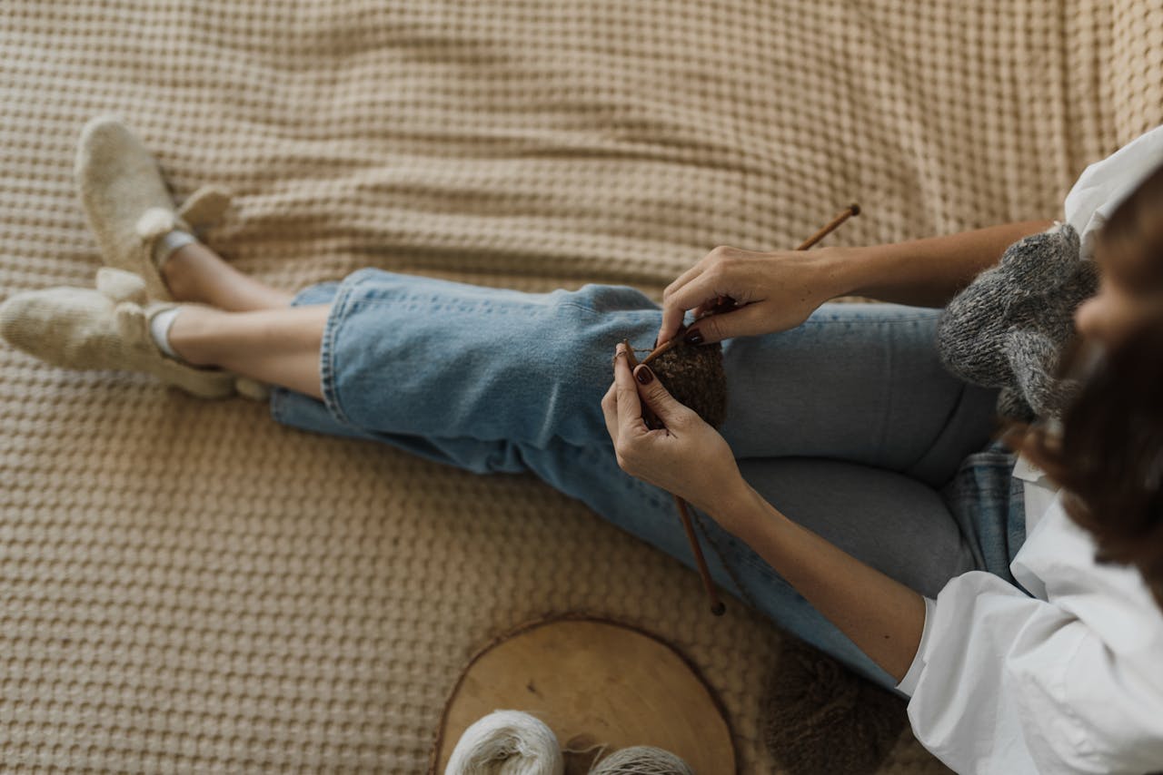 A Woman Kitting on the Bed